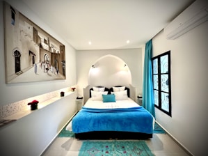 a bedroom with a bed and a mirror