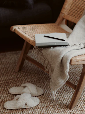 A cozy coaching session setup with navy and cream cushions and a gold-accented journal.