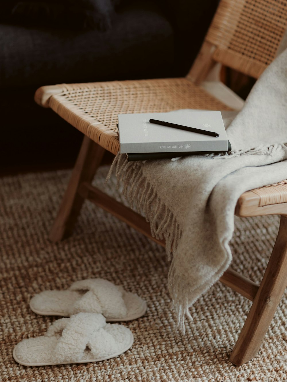 a table with a book and a pen on it