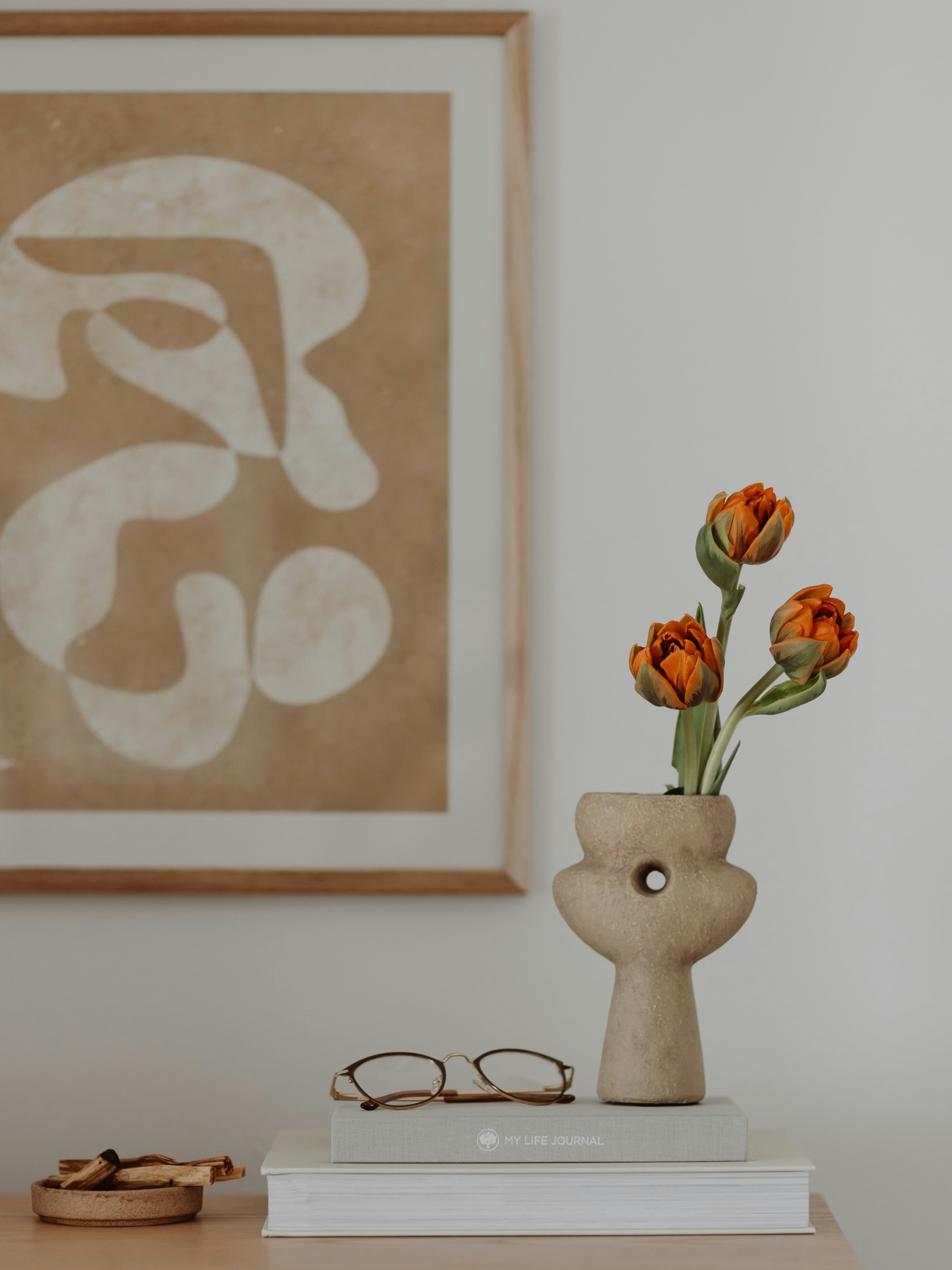 a vase with flowers on a table