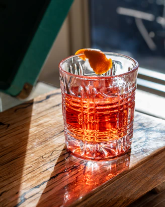 Close-up of a sleek Twistara tumbler with a vibrant swirl design on a wooden table.