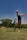 a person swinging a golf club