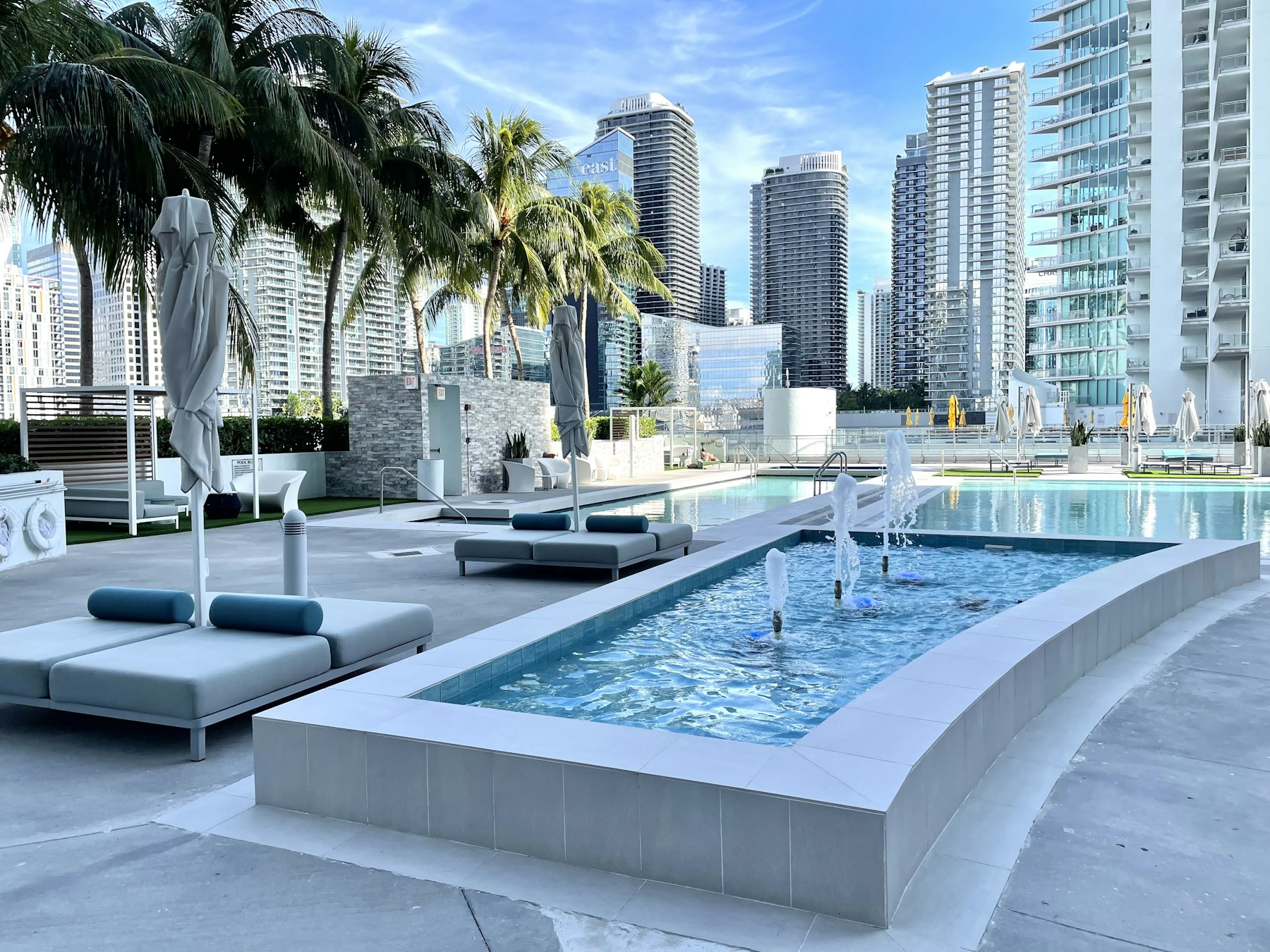 Pool terrace of a Brickell tower against the Miami skyline