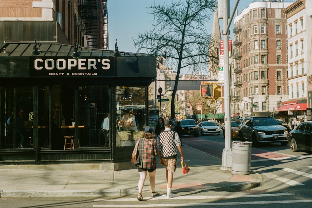 people walking on a sidewalk