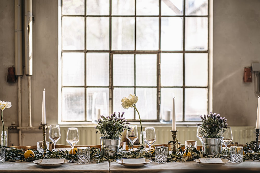 a table with candles and glasses