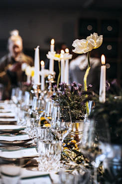 a table with candles and flowers