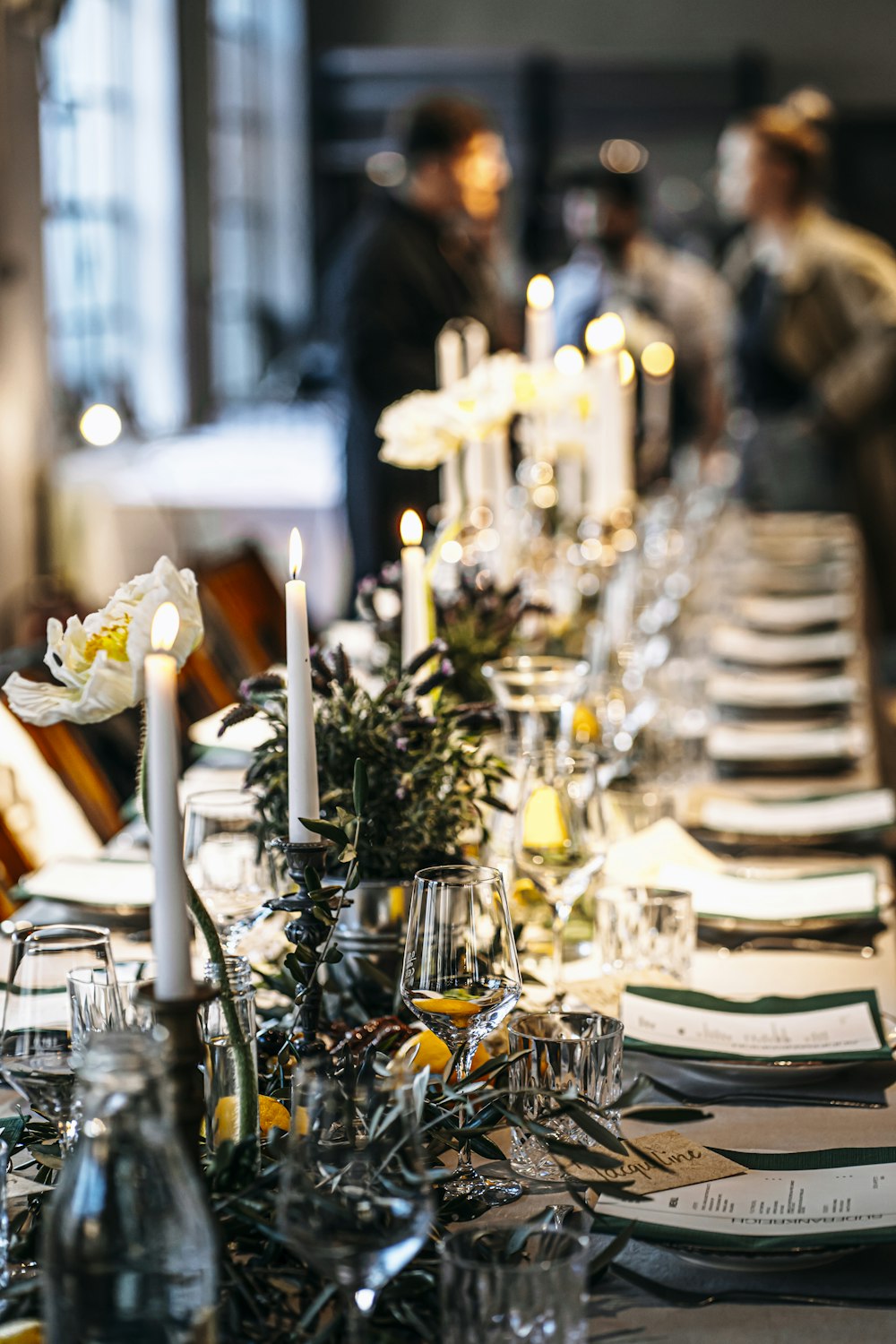 a table with candles and glasses