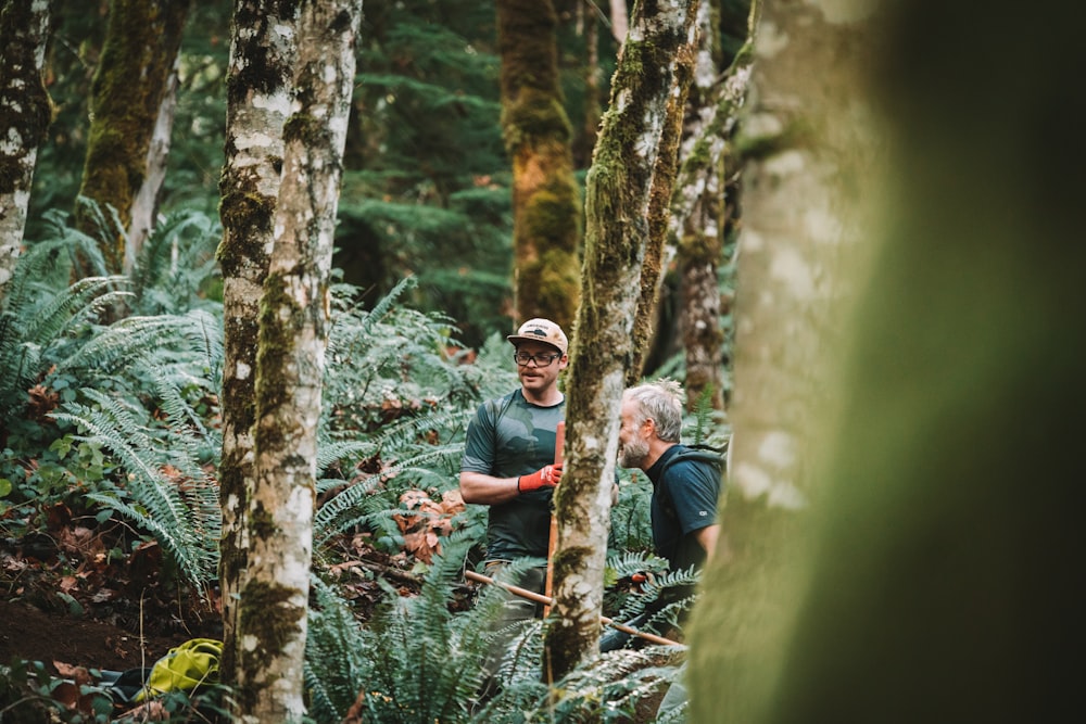 a man and woman in the woods