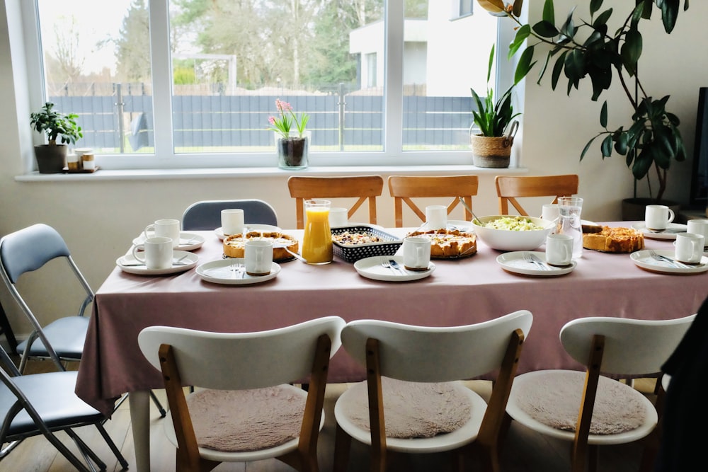 a table with plates and cups on it