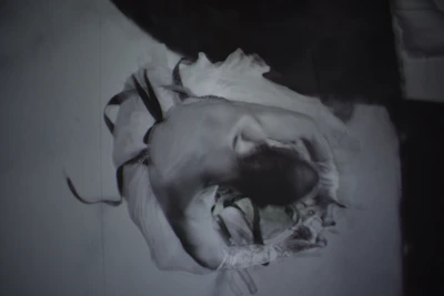 Artistic black and white photo of a dancer frozen in motion.