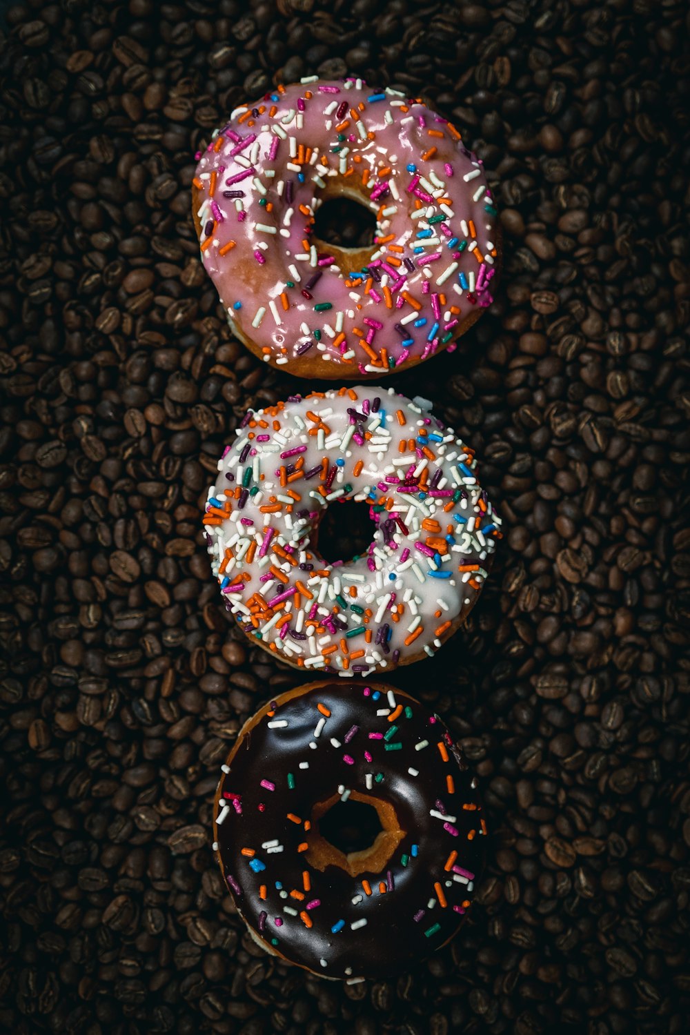 a group of donuts with sprinkles on them