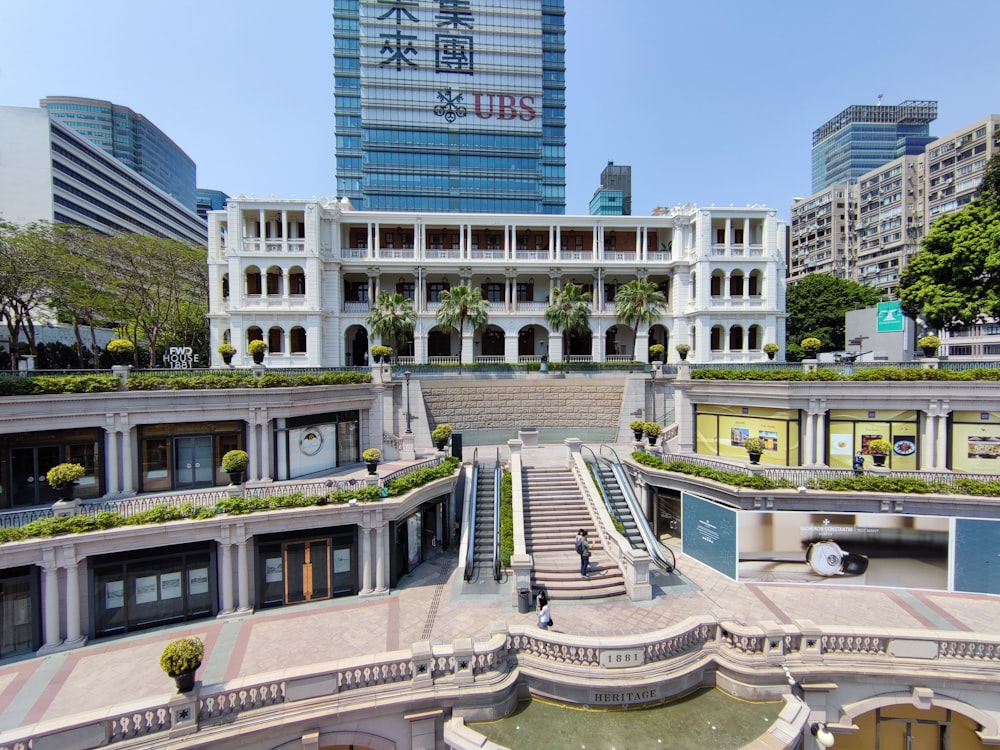 a large building with a pool in front of it