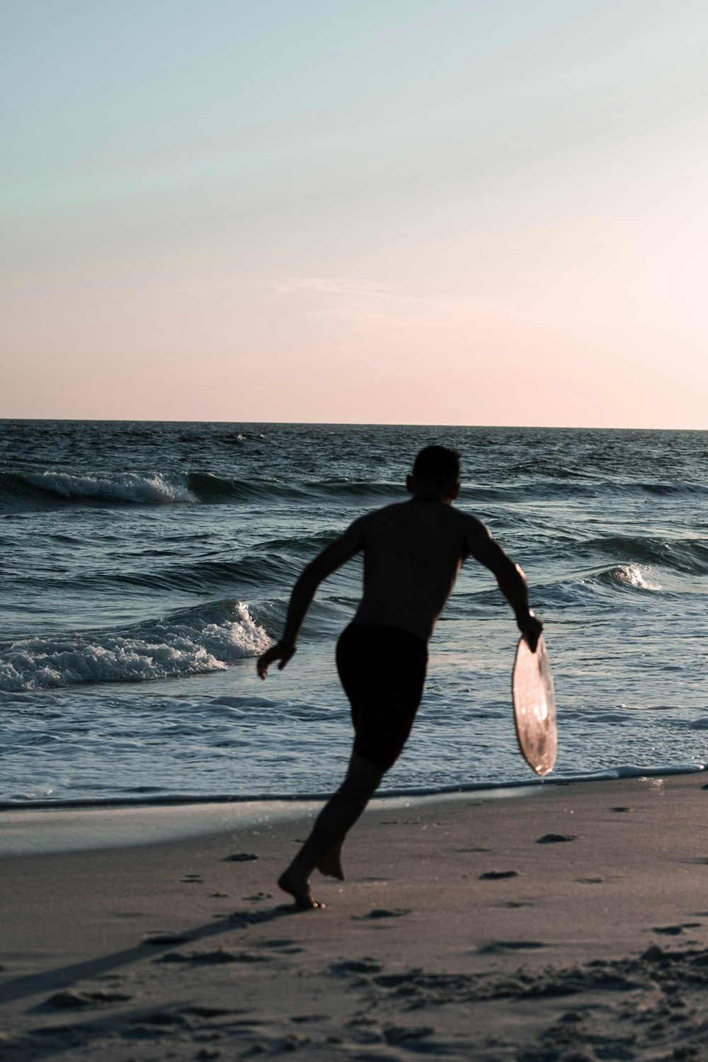 a man running on a beach