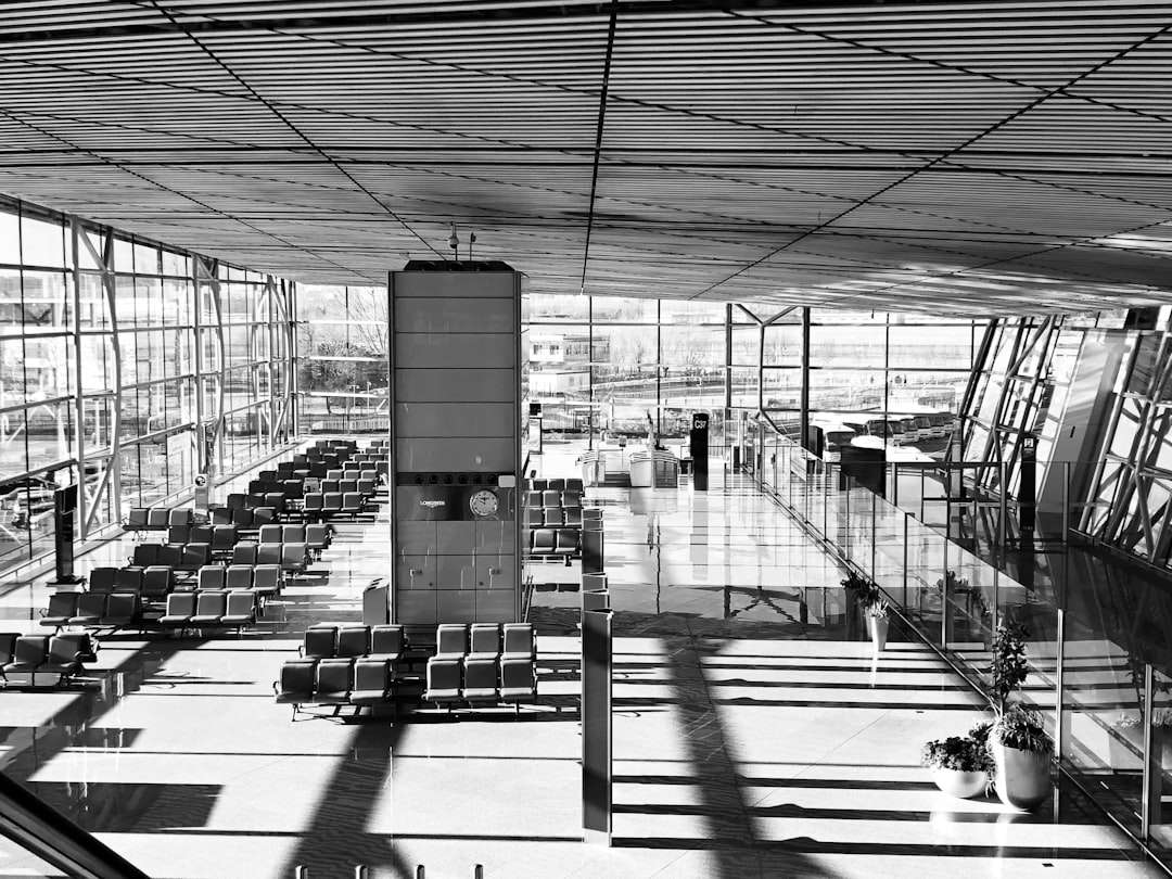 a large room with chairs and a large glass wall,