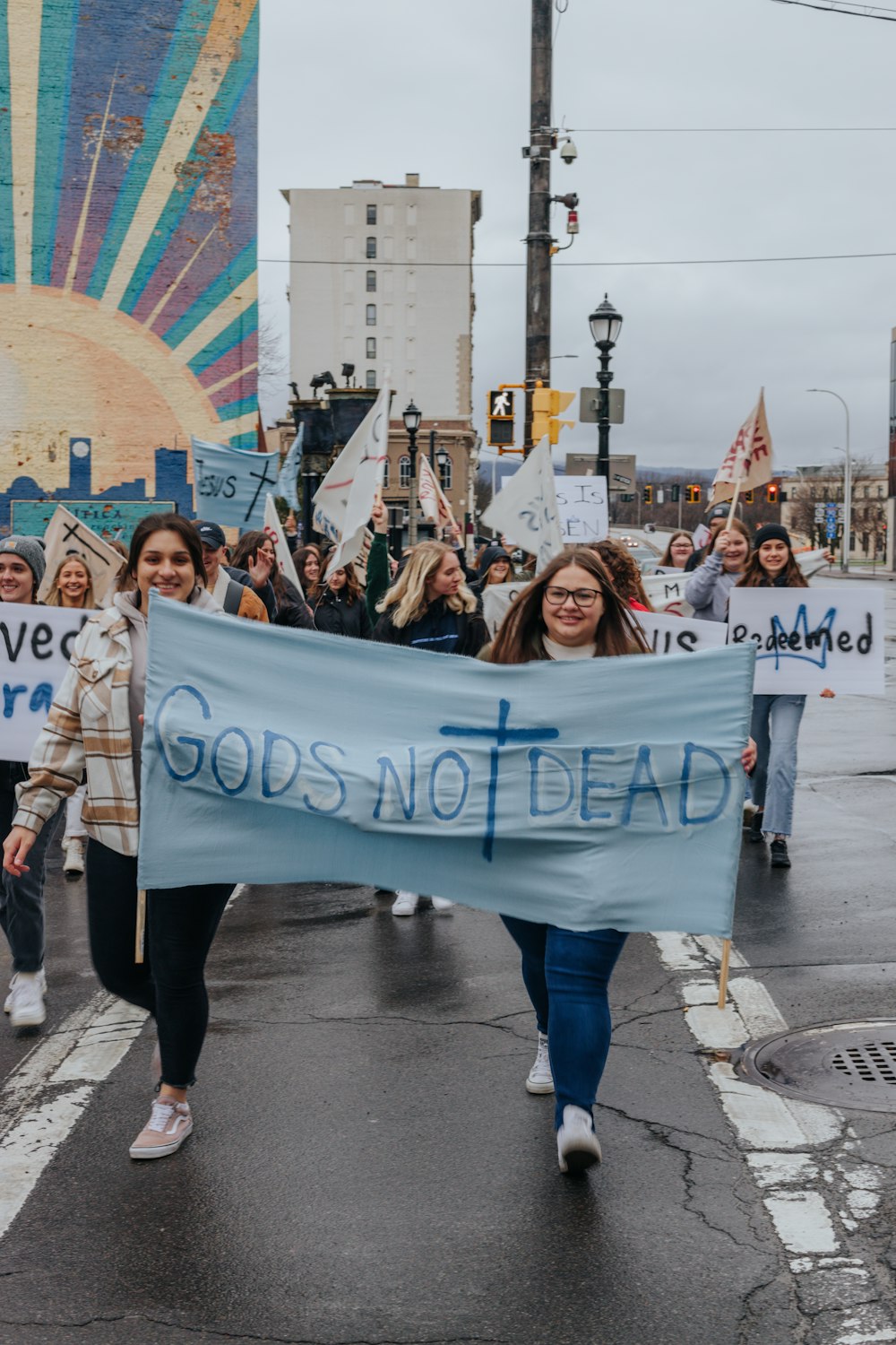 a group of people marching with a banner