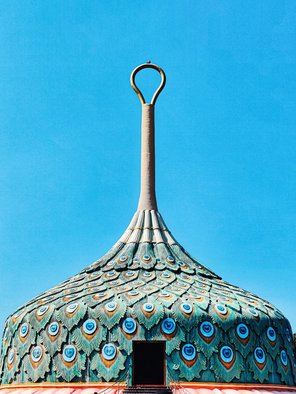 a domed building with a blue sky