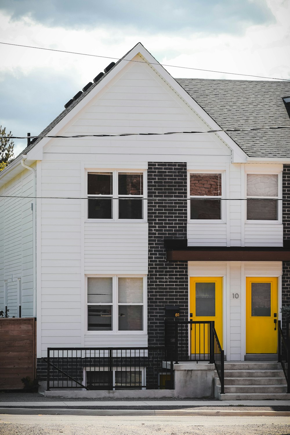 a white house with yellow doors