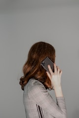 a woman holding a phone