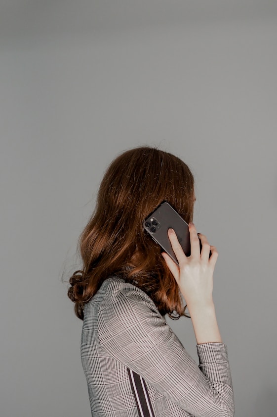 a woman holding a phone