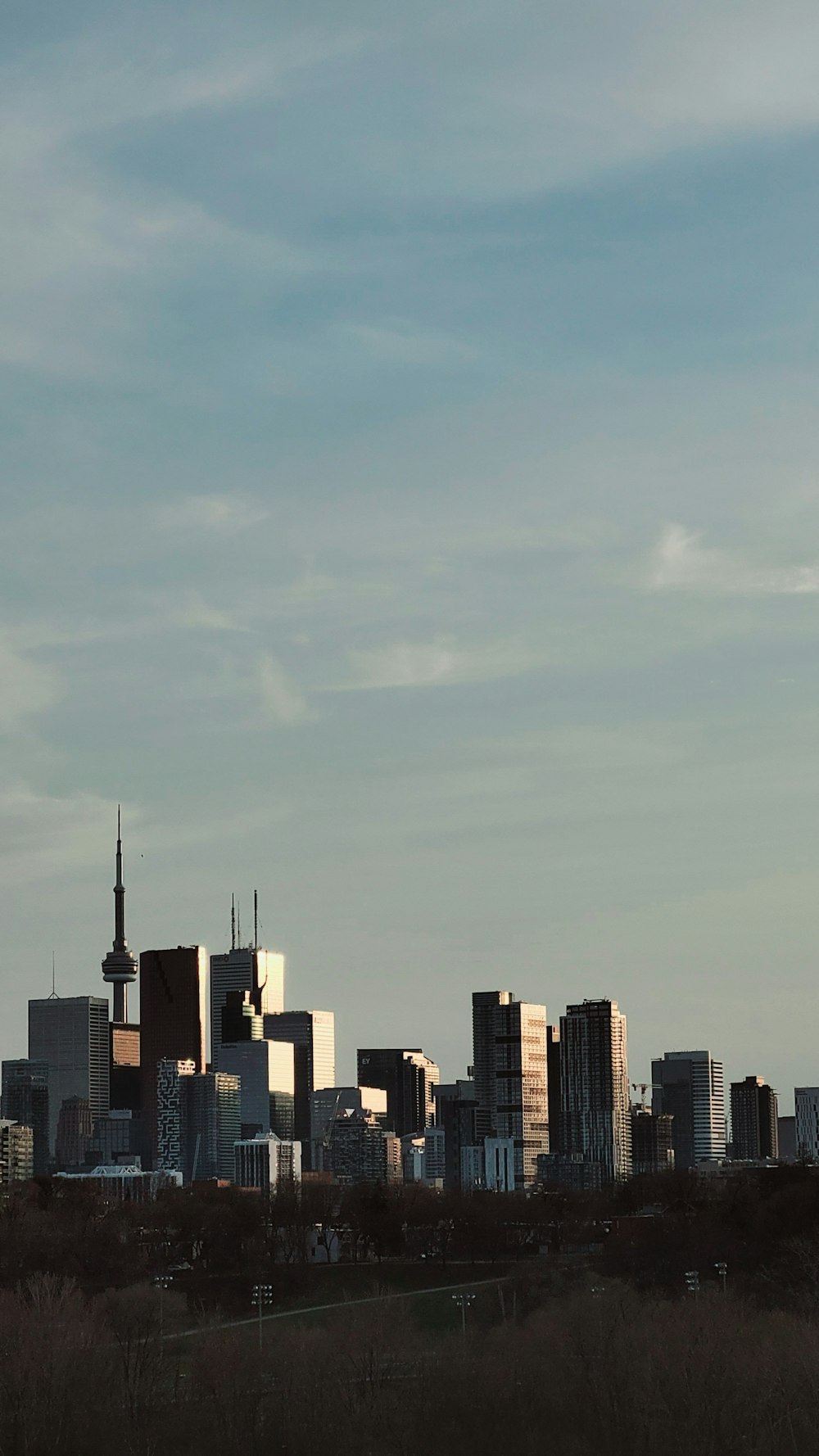 a city skyline with a blue sky