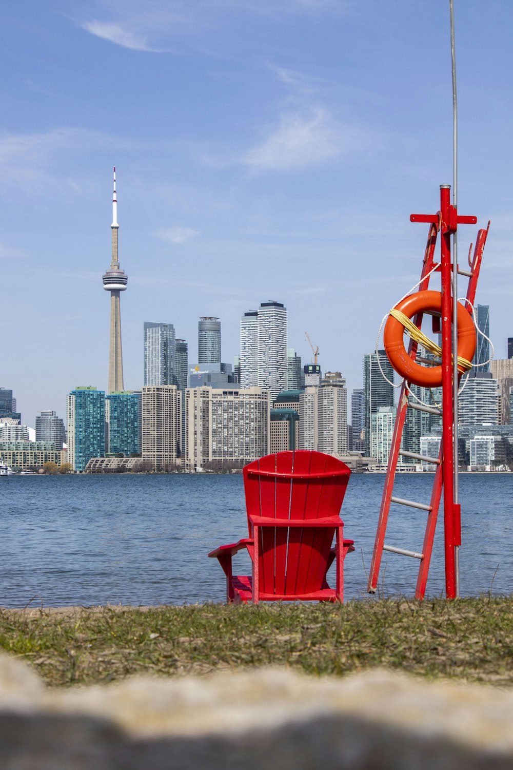 a red chair on a dock
