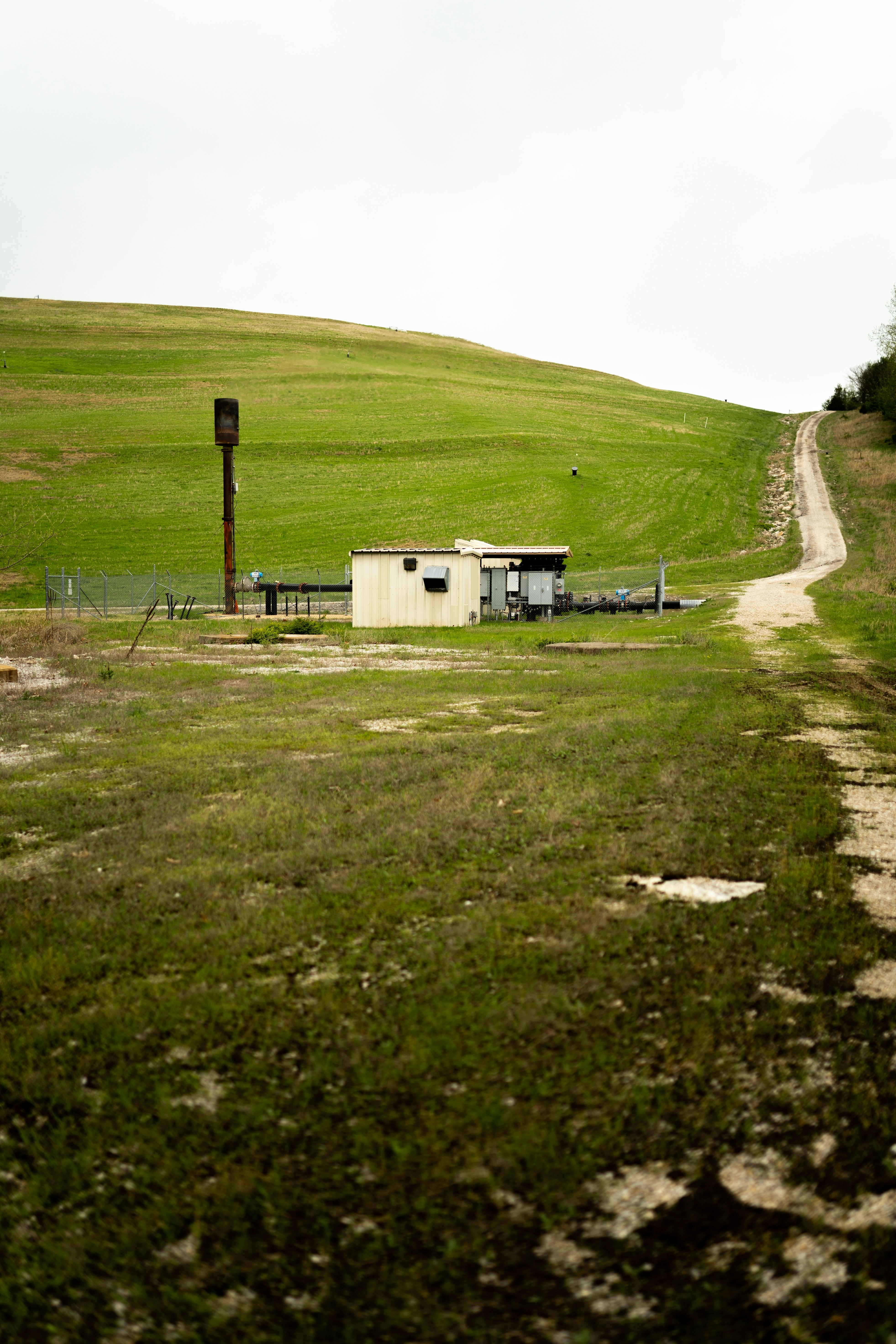 A small building on a hill photo – Free Green Image on Unsplash