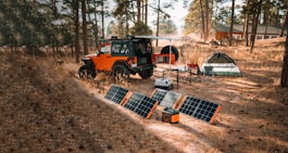 a truck parked next to solar panels
