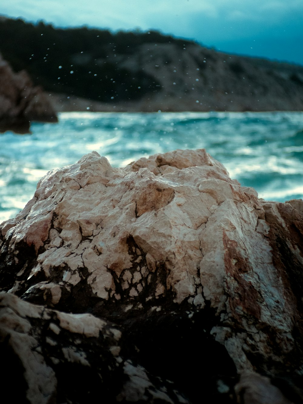 a large rock on a beach