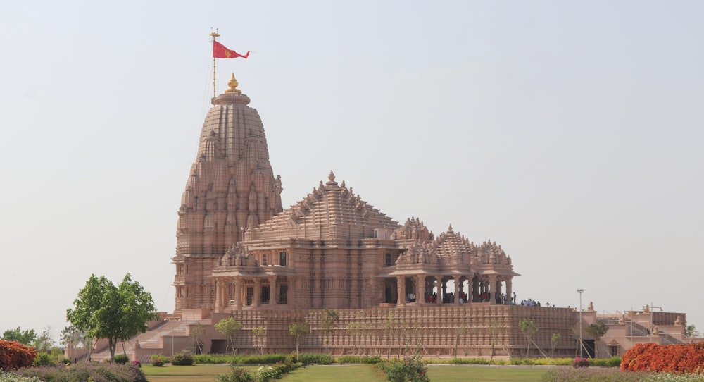 a large building with a flag on top