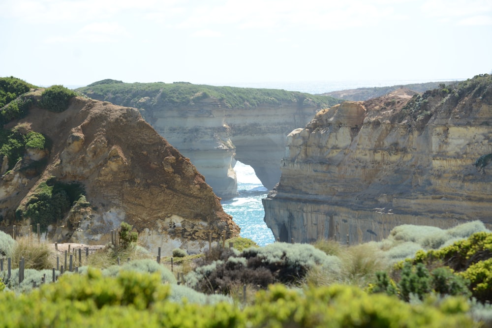 a cliff with a body of water below