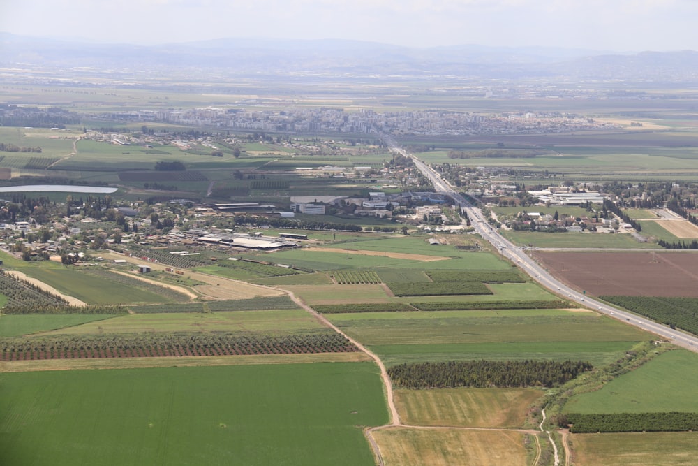 an aerial view of a green landscape