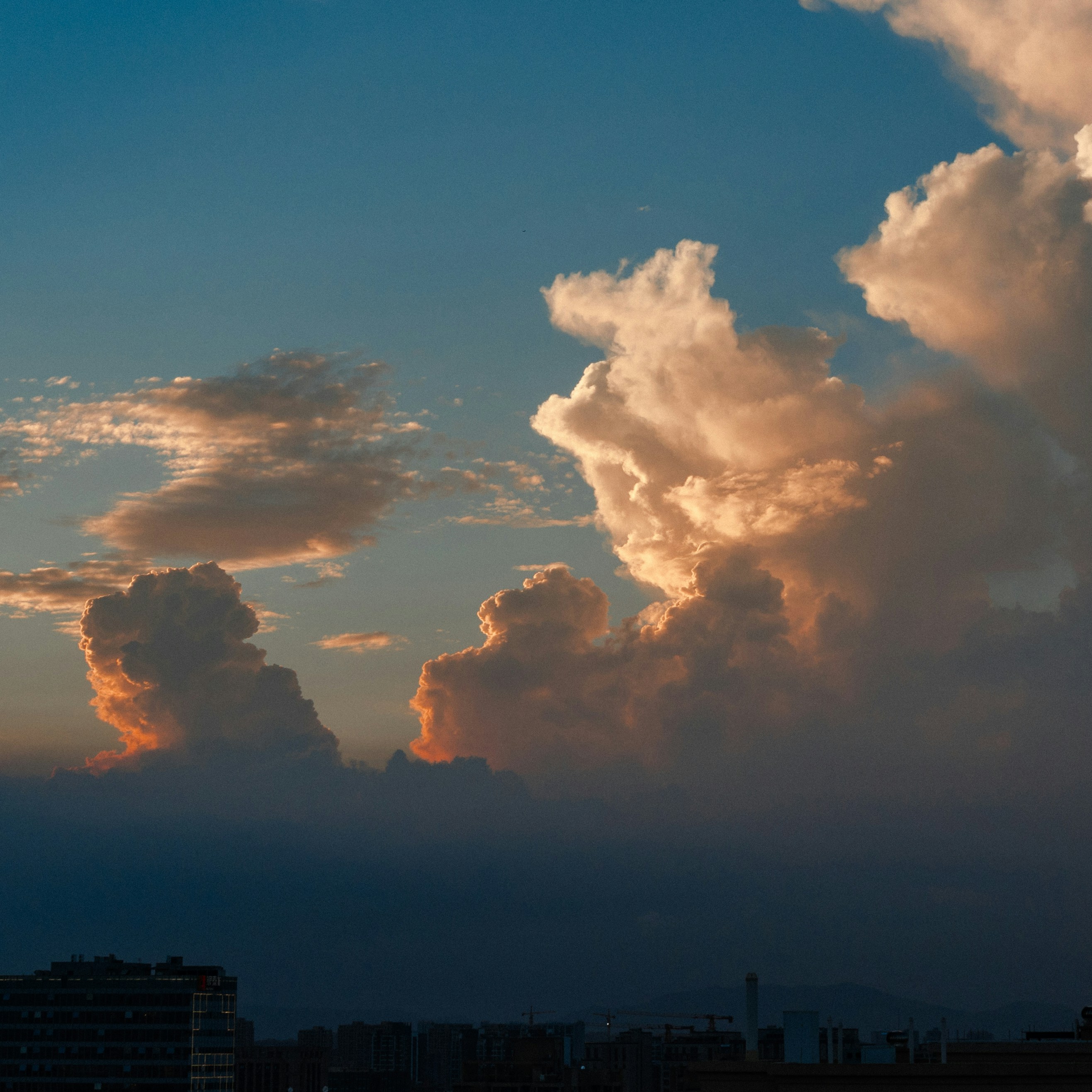 a cloudy sky over a city