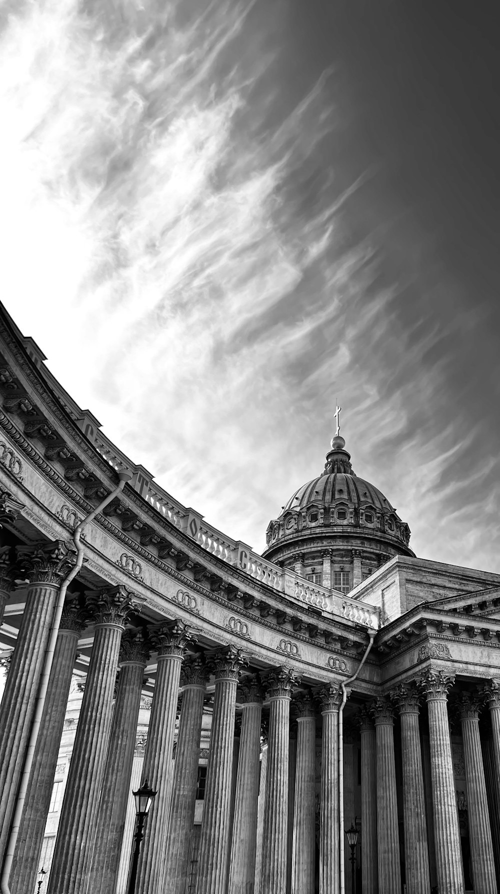 a building with a dome and columns