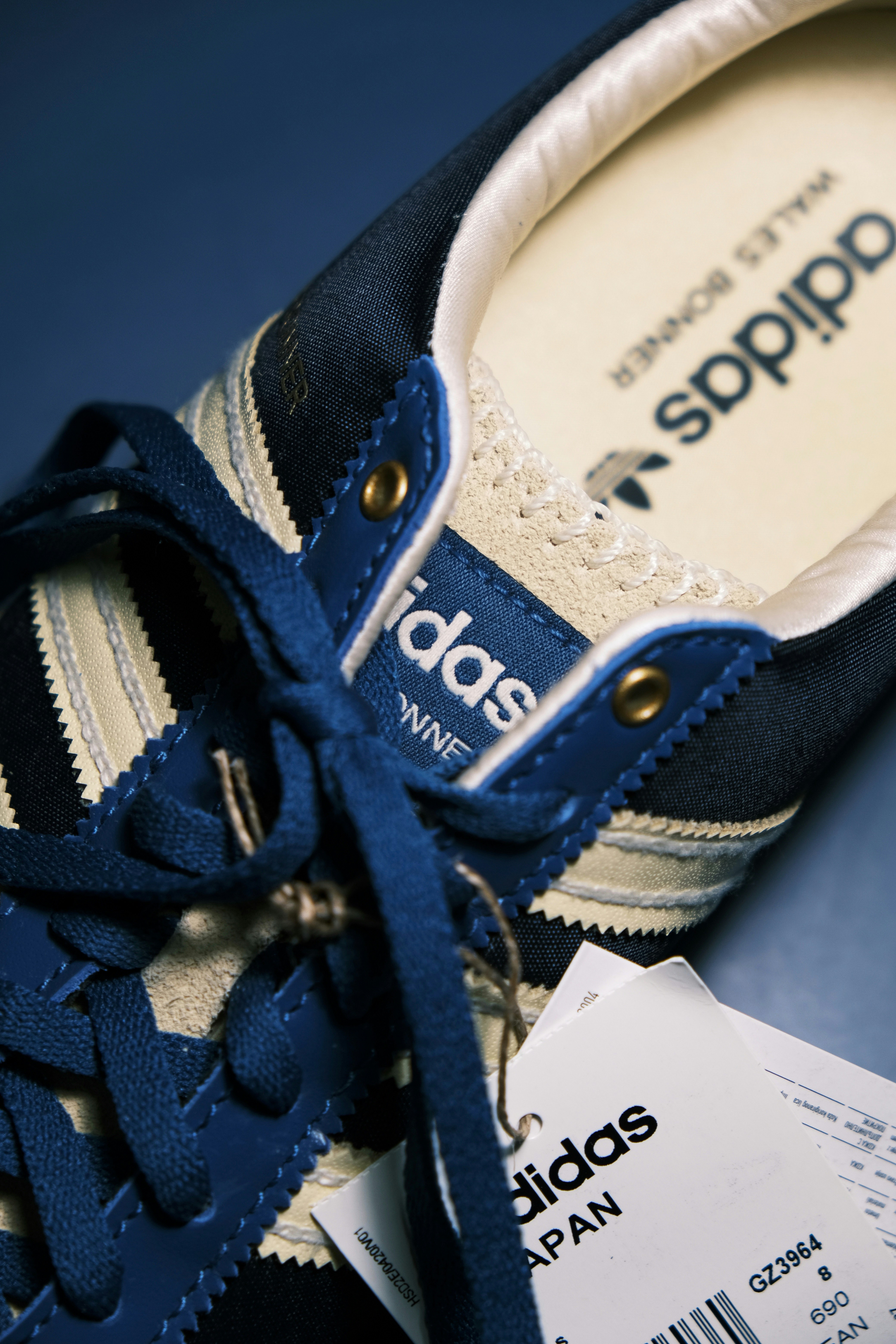 a pair of blue and white tennis shoes