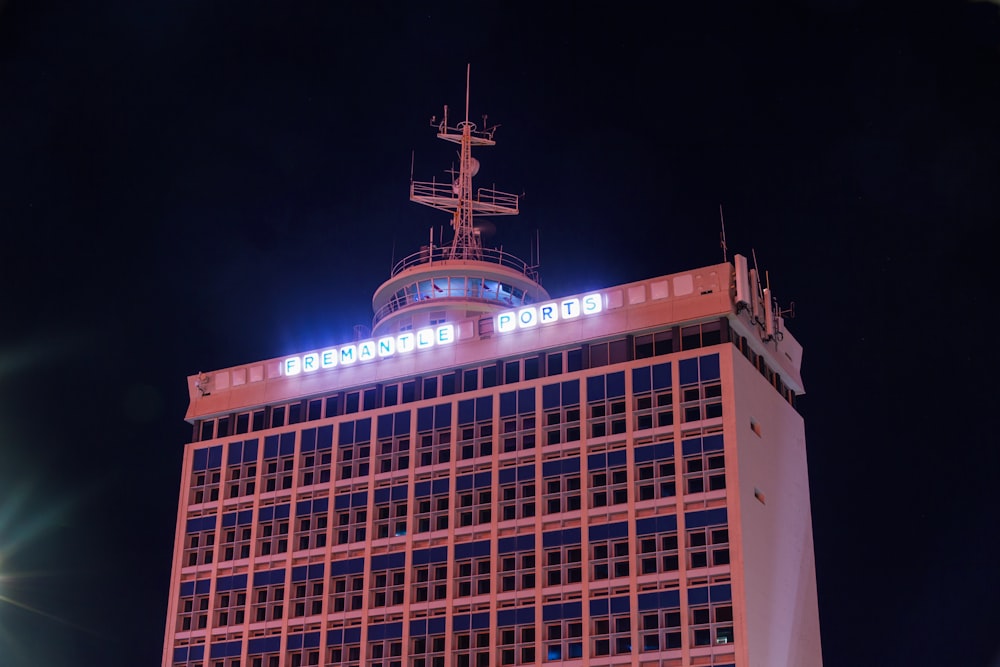 a tall building with lights at night