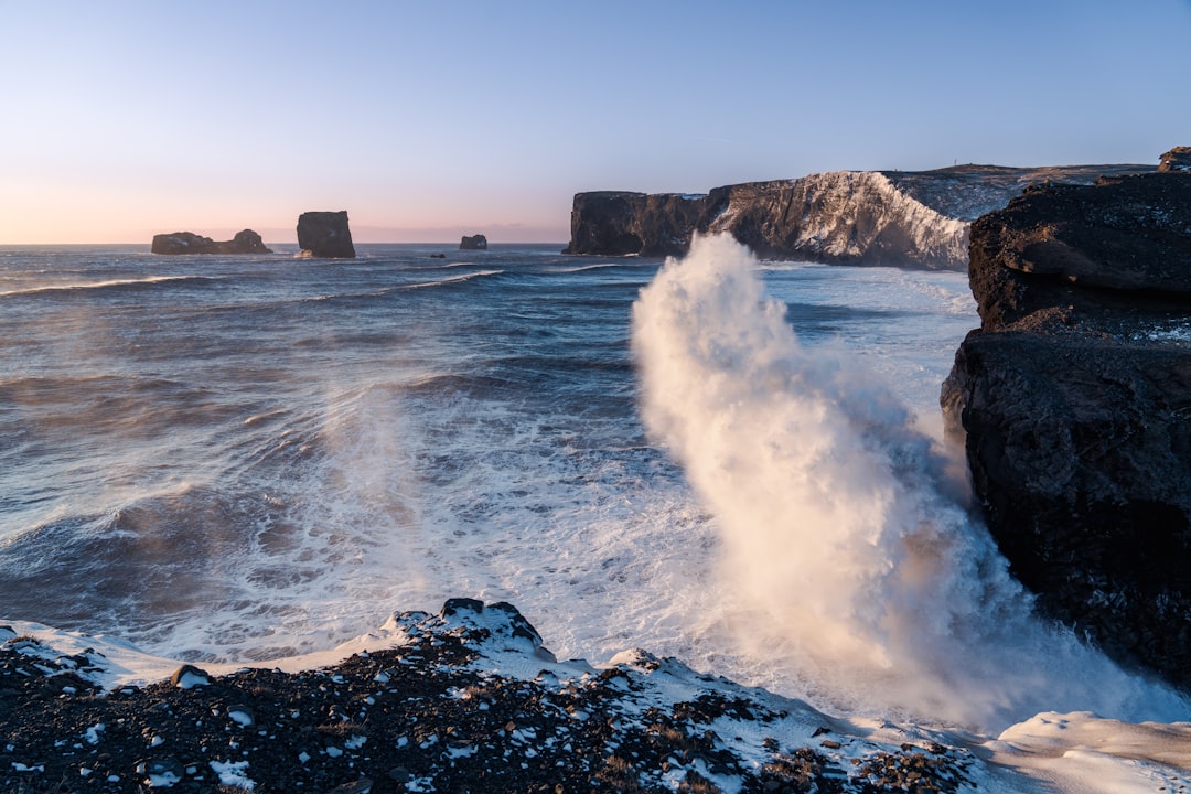 waves crashing against rocks,