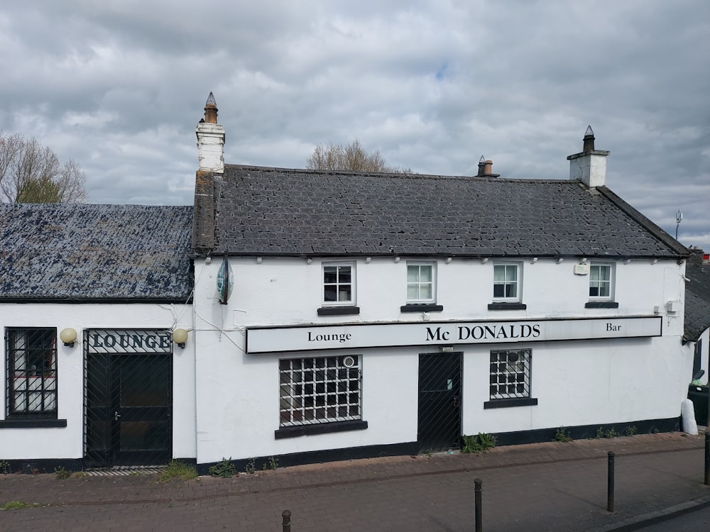 a white building with a black door