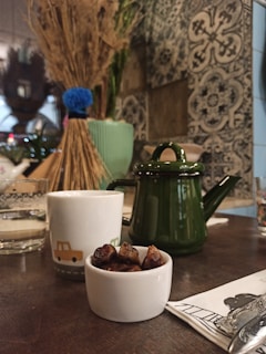 Traditional Moroccan tea set arranged on a carved wooden table inside the hotel.