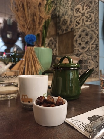 Traditional Moroccan tea set arranged on a carved wooden table inside the hotel.
