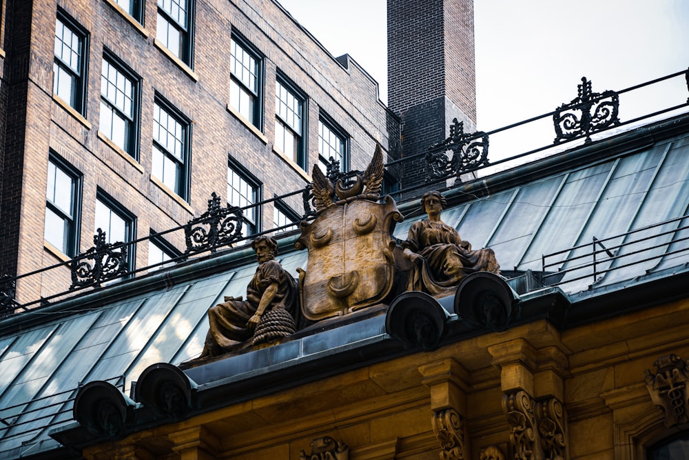 a group of statues on a building