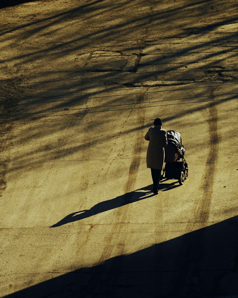 a person walking with a motorcycle