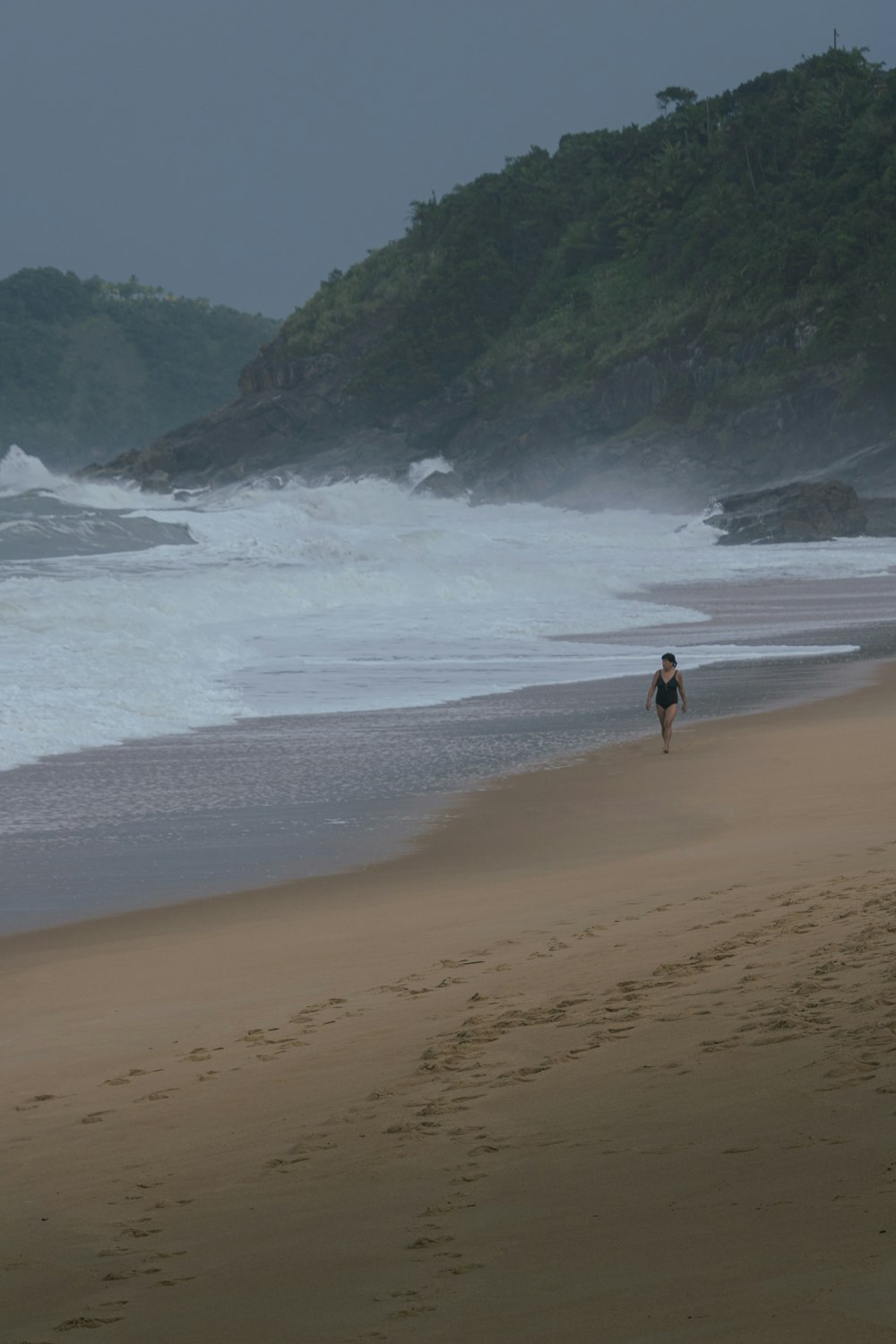 a man walking on a beach