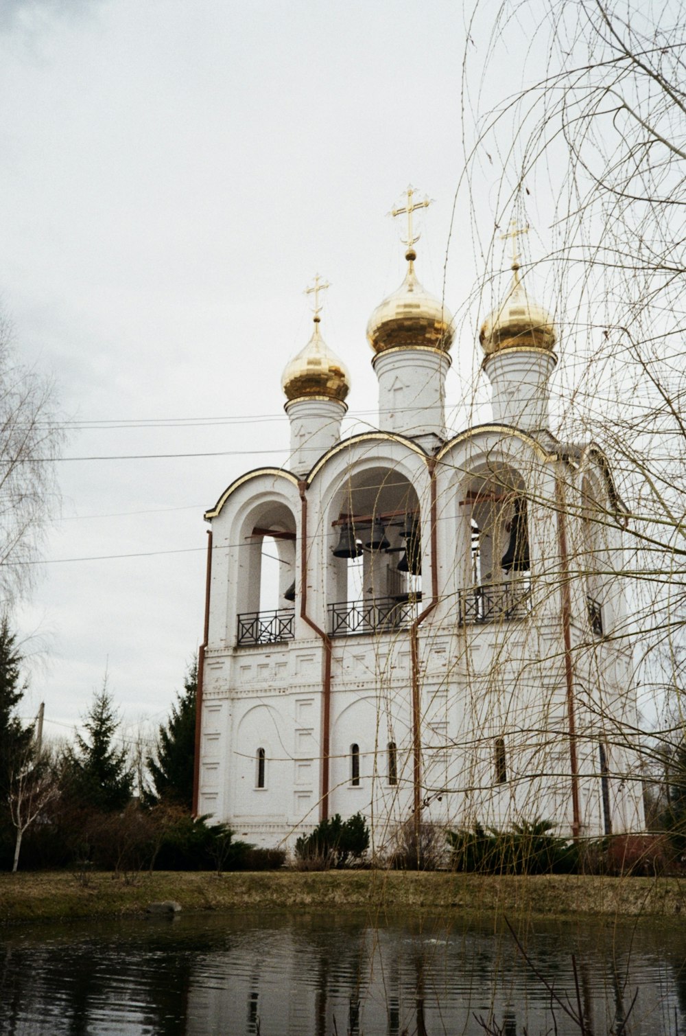 a white building with gold domes