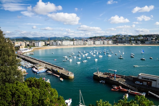 a body of water with boats in it and buildings around it