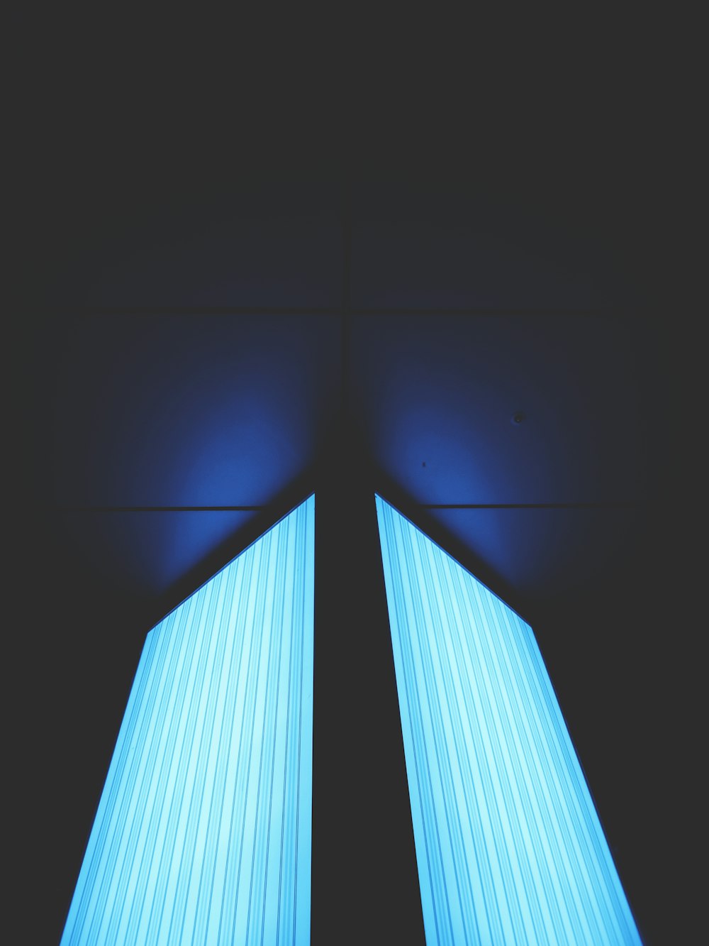 a blue light in a dark room