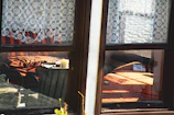 Warm, sunlit interior featuring a cozy corner decorated with Seasoul Charms woven pieces.