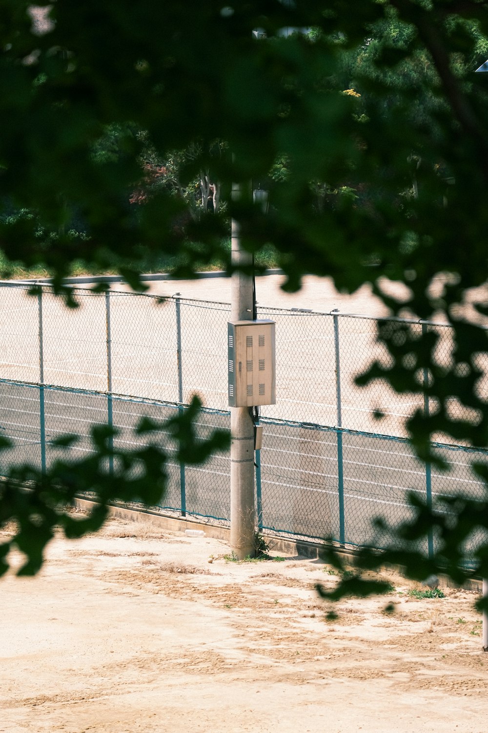 a white fence with a sign on it