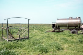 a large metal tank in a field