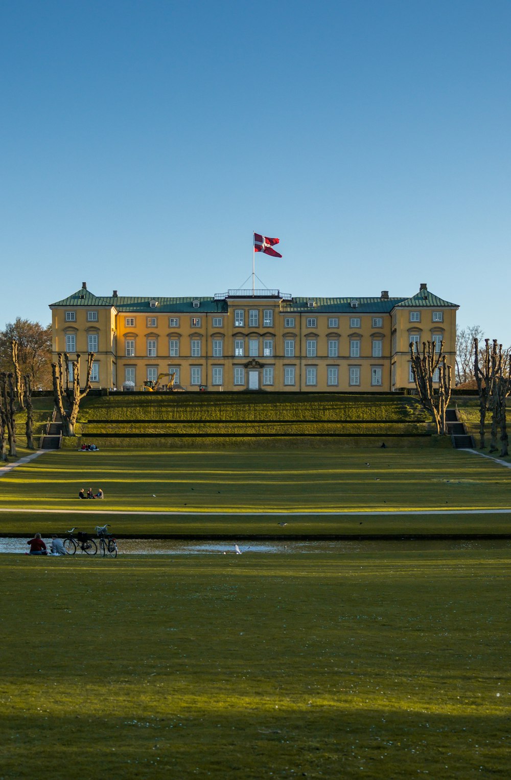 a large building with a flag on top