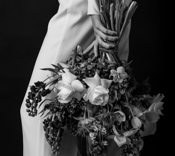 a person holding a bouquet of flowers